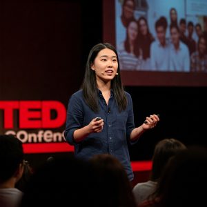 A woman giving a TED talk